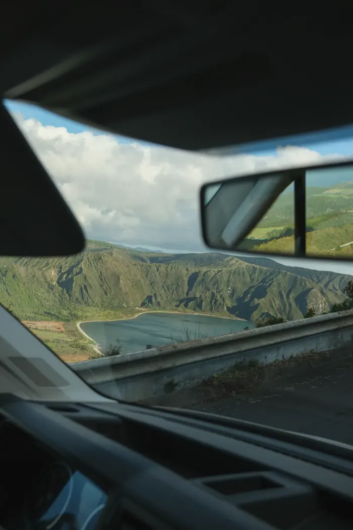 Road through São Miguel seen from campervan windshield